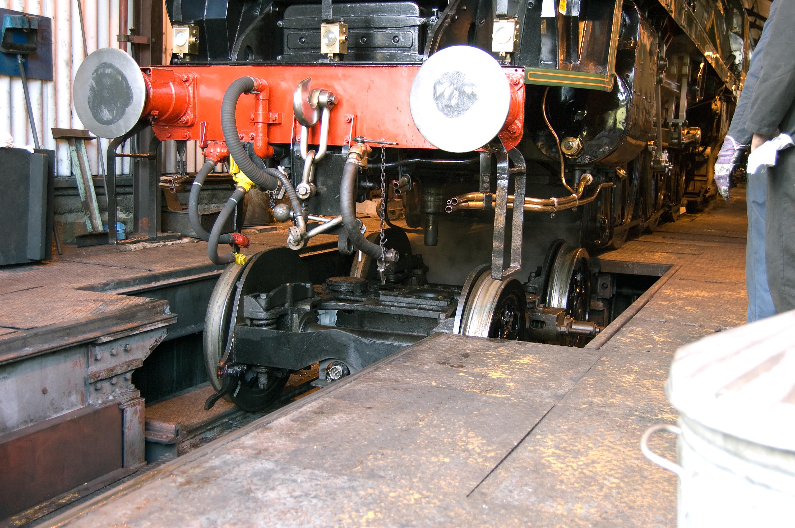 The bogie is lowered by the Ropley wheeldrop, so that some of the rivets can be attended to.