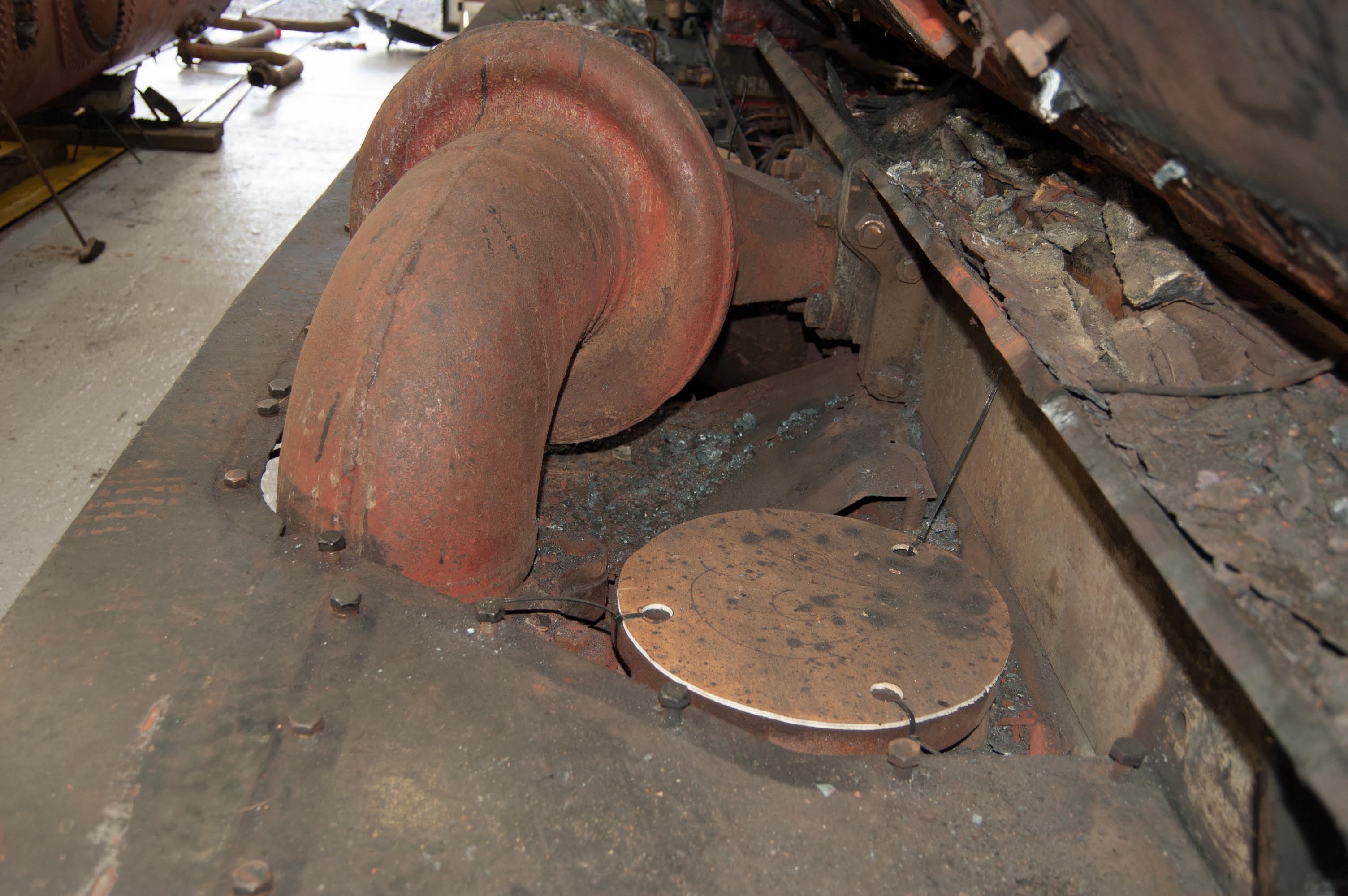 This is where the steam pipe to the fireman's side engine used to fit. The cover is to stop debris falling in, and damaging the valve.