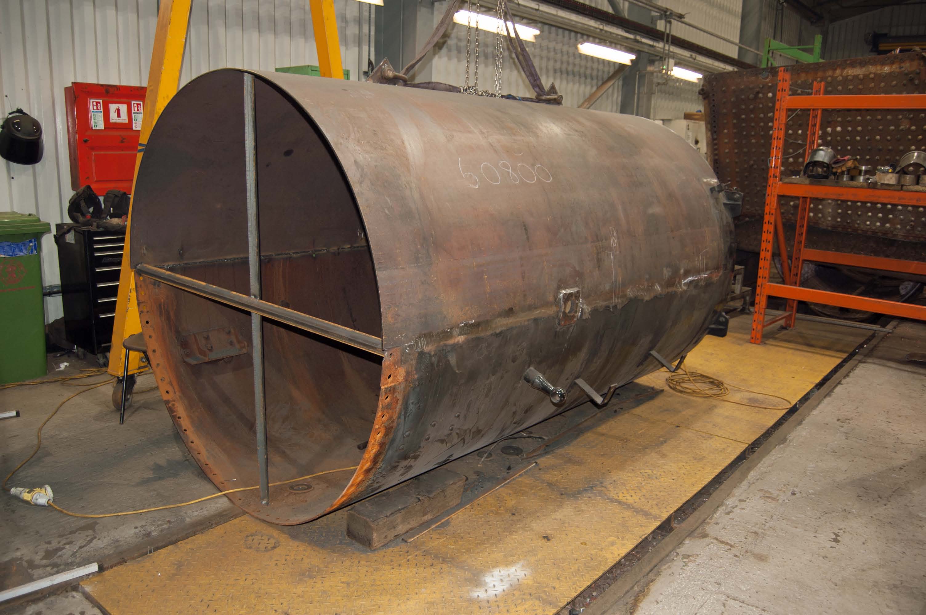 The new bottom half of the smokebox is in the process of being welded to the top half (it is upside down).